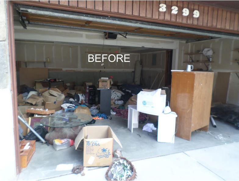 A garage filled with lots of junk and boxes